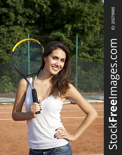 Woman with tennis racket on tennis court. Woman with tennis racket on tennis court