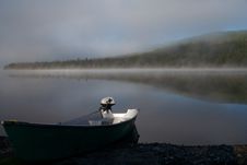 Boat On A Misty Lake Stock Image