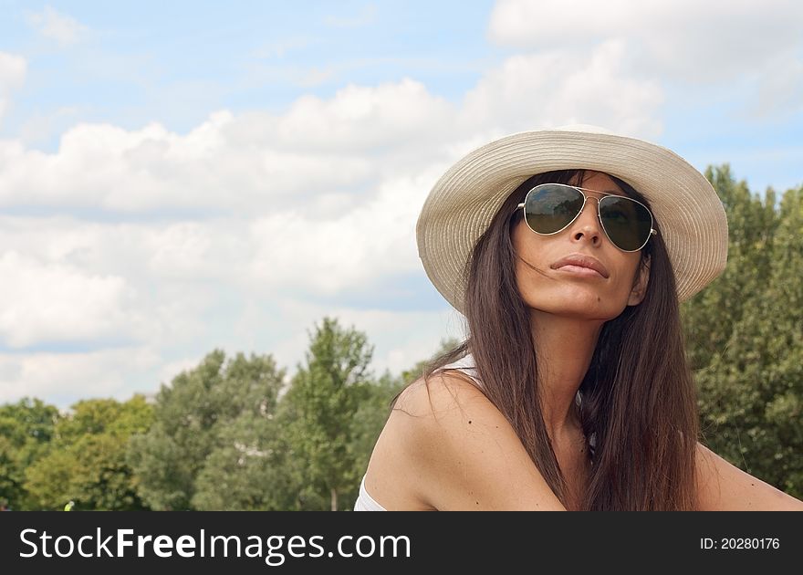 Beautiful Woman In A Park On A Summer Day