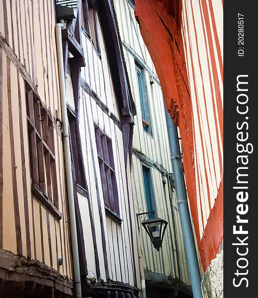 Colorful buildings in the narrow streets of Rouen, ont of the most famous cities in the Normandy, France. Colorful buildings in the narrow streets of Rouen, ont of the most famous cities in the Normandy, France.