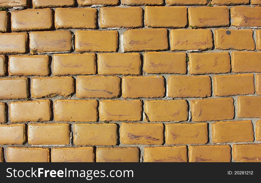 Old wall made from yellow bricks texture