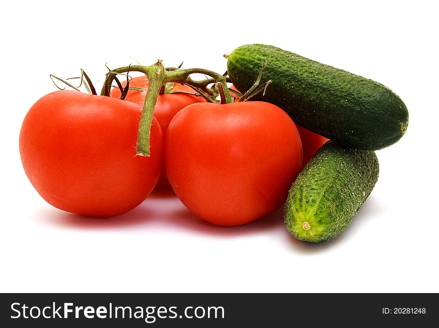 Foto of cucumbers  and tomatoes in room