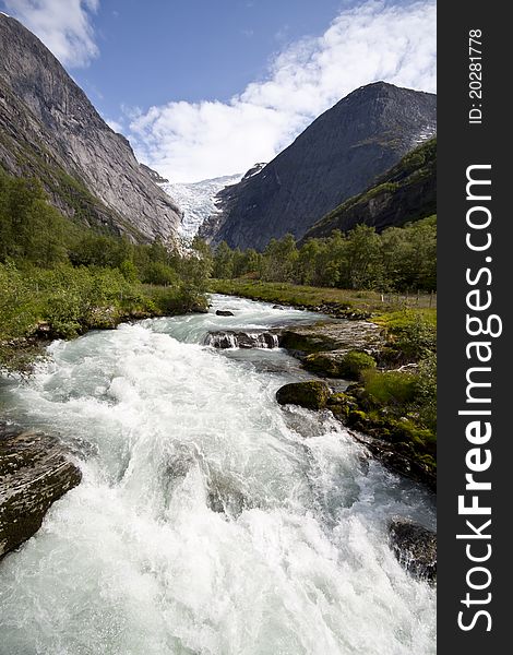Mountain river and glacier Bricksdal  in Jostedalsbreen national park, Norway. Mountain river and glacier Bricksdal  in Jostedalsbreen national park, Norway