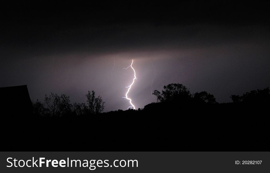 Image of lightning with silhouette foreground. Image of lightning with silhouette foreground.