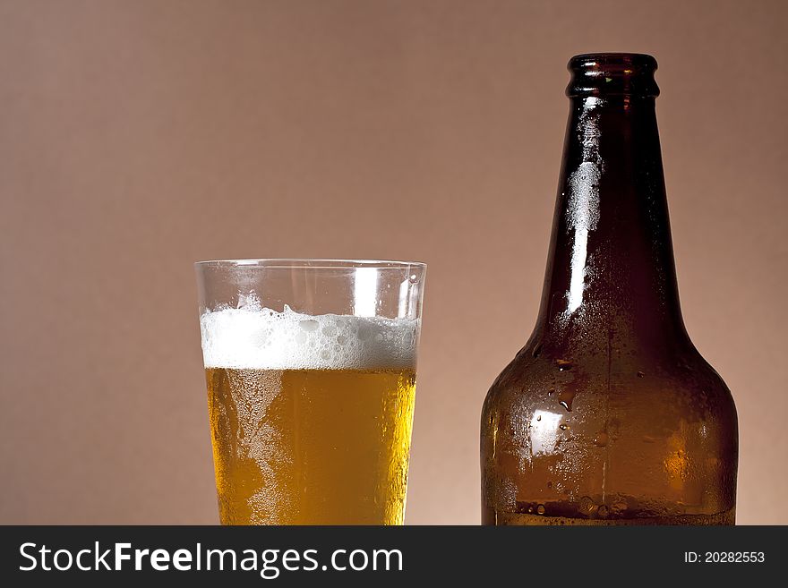 Cool bottle and glass of beer. Cool bottle and glass of beer