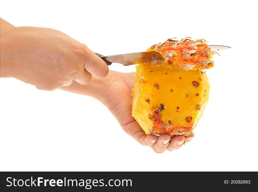 Using A Fruit Knife To Remove The Skin Of A Pineapple. Image Is On A White Background. Using A Fruit Knife To Remove The Skin Of A Pineapple. Image Is On A White Background