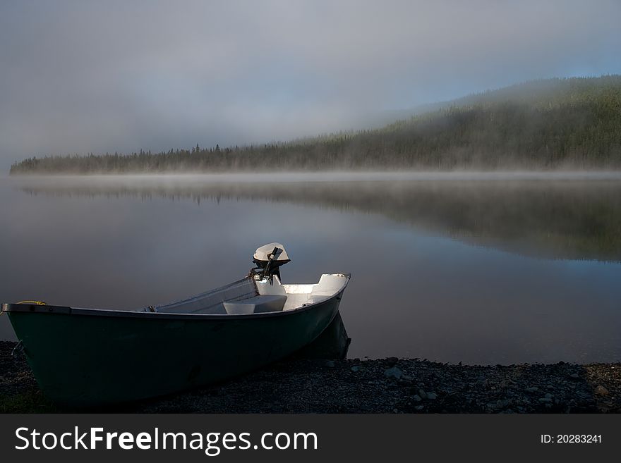 Boat on a misty lake