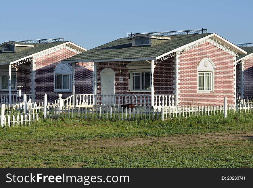 Holiday resort cabins in grassland.