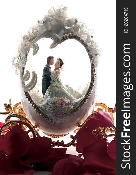 The wedding couple in a carriage. isolated background. The wedding couple in a carriage. isolated background
