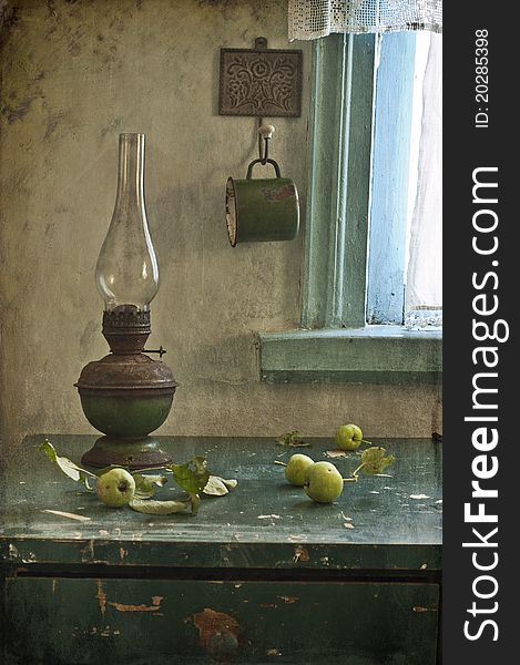 Kerosene lamp and apples