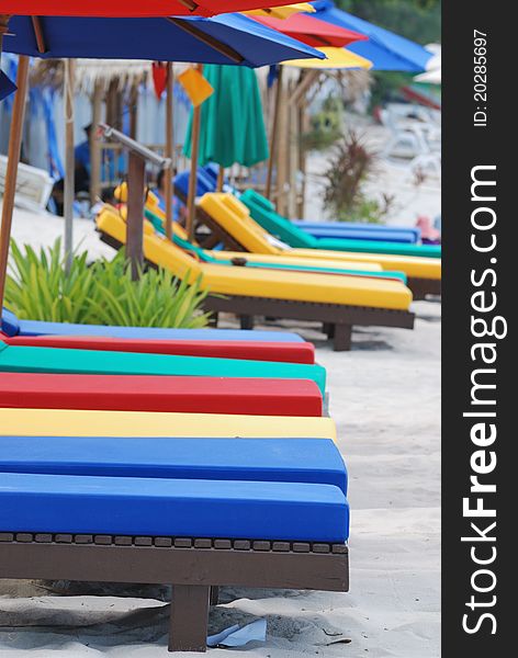 Many of colorful beach chairs on the beach with shallow depth of field