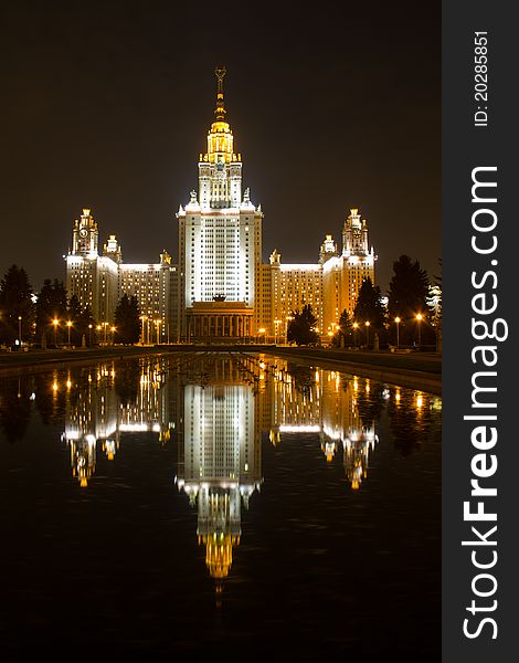 Moscow State University in night with reflection on dark water