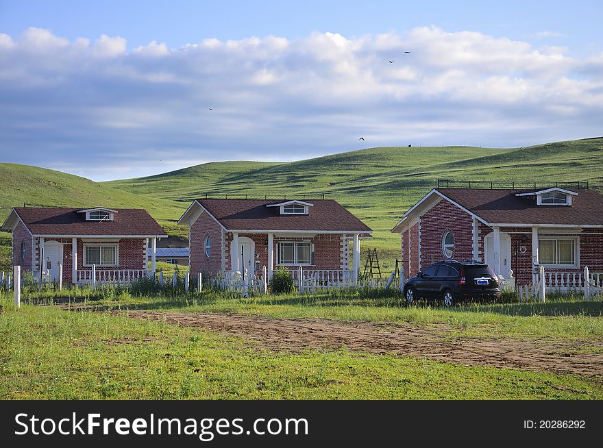 Holiday resort cabins in grassland.