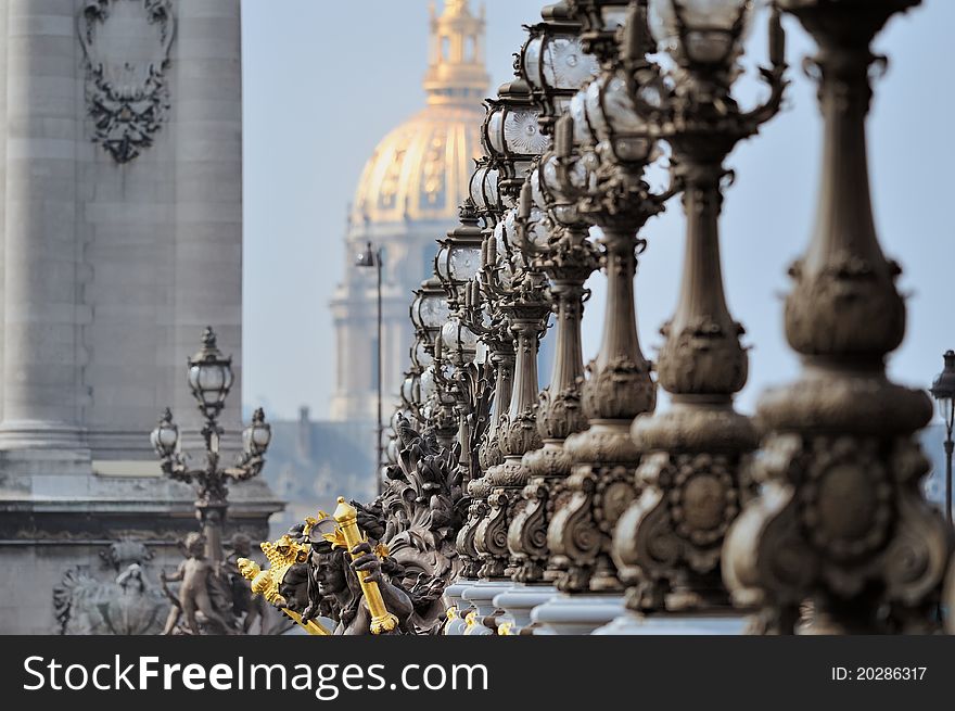 Lampposts on the bridge and the golden Dome of the Cathedral. Lampposts on the bridge and the golden Dome of the Cathedral