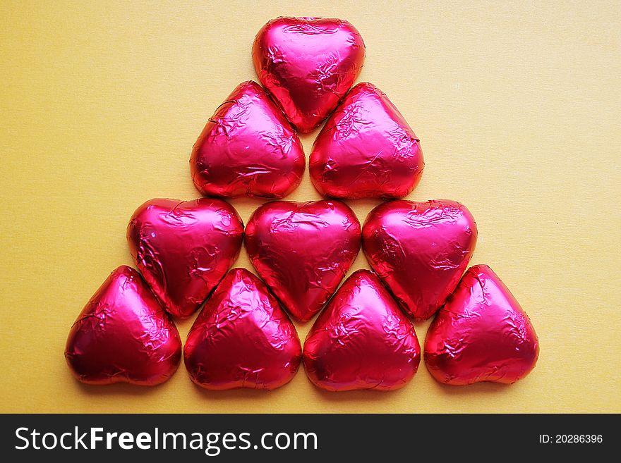Chocolate candy hearts in a pink foil