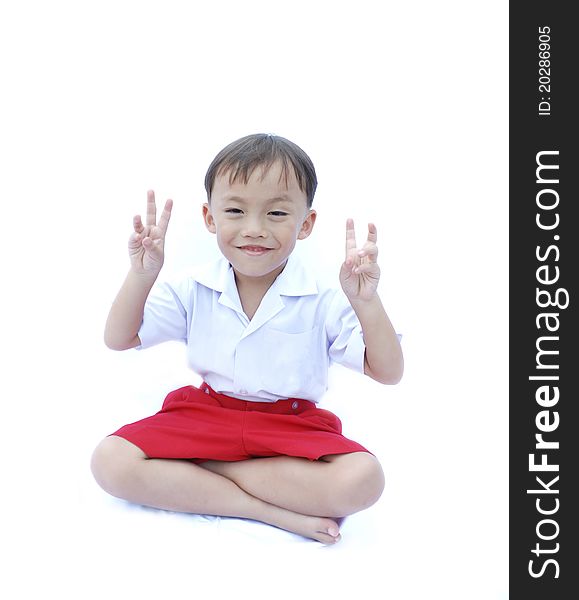 Cute young asian boy in uniform isolated on white background