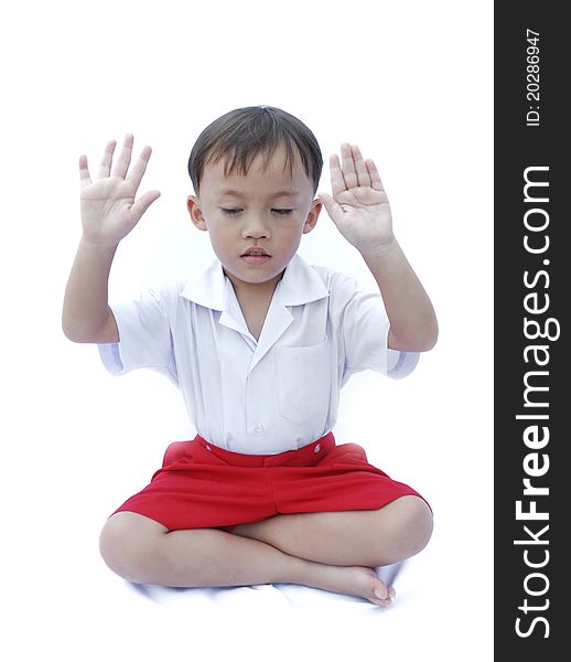 Cute young asian boy in uniform isolated on white background