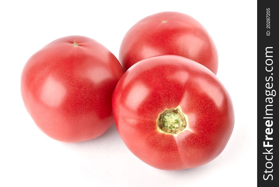 Three tomatoes isolated on white background