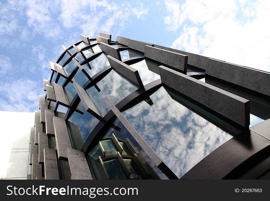 Exterior of modern glass building detail with sky reflections. Exterior of modern glass building detail with sky reflections