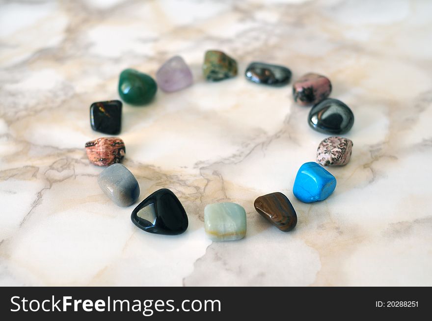 Small polished colorful stones in circle. Small polished colorful stones in circle