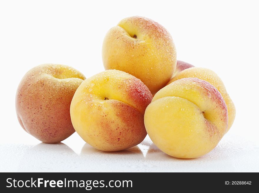 Fresh apricots on white background