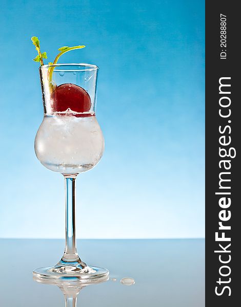 Drink in glass of glass with radish on plexiglass plan. Drink in glass of glass with radish on plexiglass plan