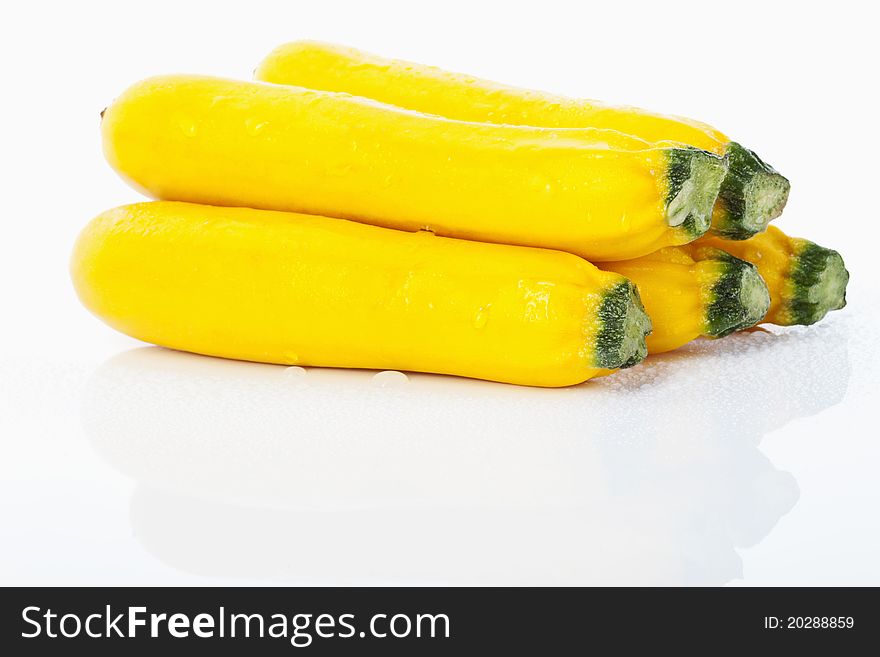 Yellow zucchinis on white background