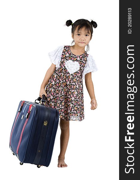 Cute little girl carrying her luggage over white background. Cute little girl carrying her luggage over white background