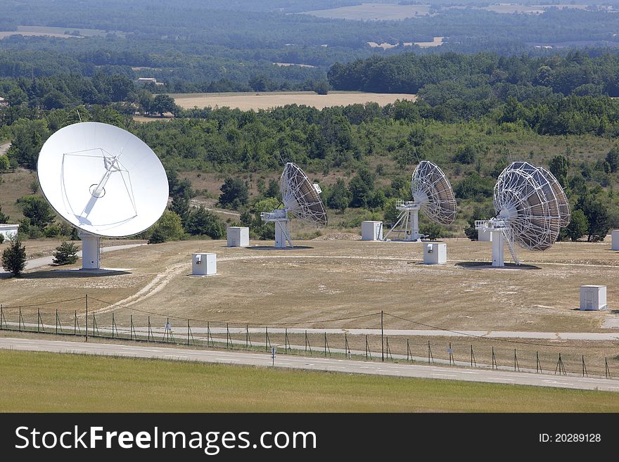 Radio antenna dishes capturing waves in the sky. Radio antenna dishes capturing waves in the sky