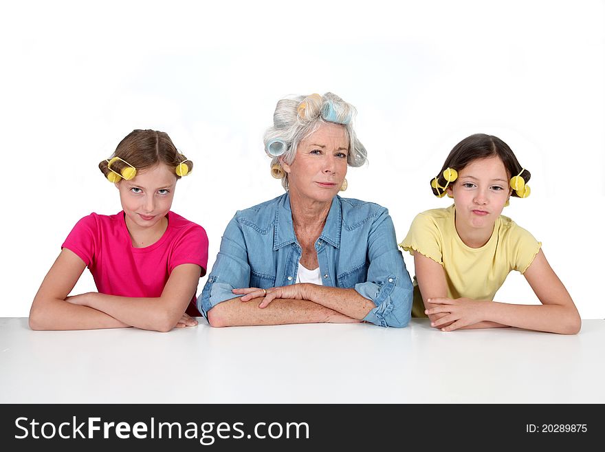 Senior women and kids with hair curlers. Senior women and kids with hair curlers