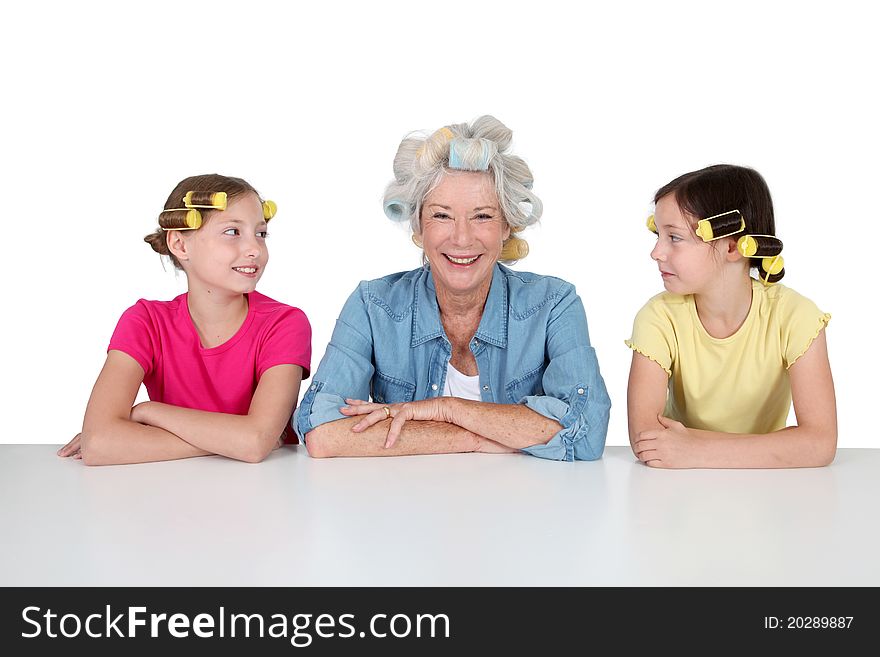 Senior women and kids with hair curlers. Senior women and kids with hair curlers