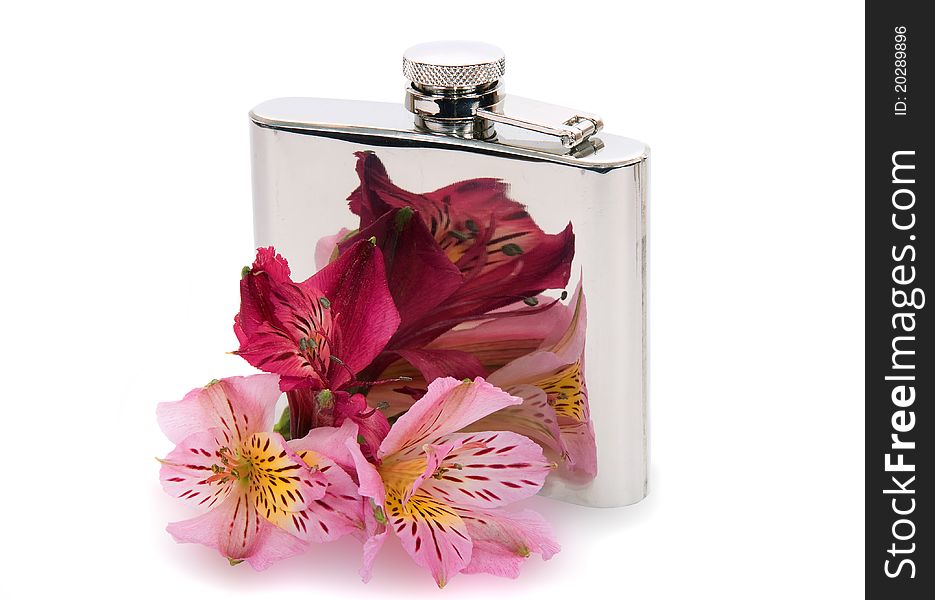 Steel flask for wine and flowers on a white background