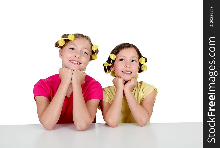 Portrait of young girls with hair curlers. Portrait of young girls with hair curlers