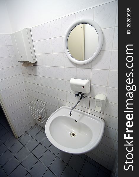 Small white restroom in hotel