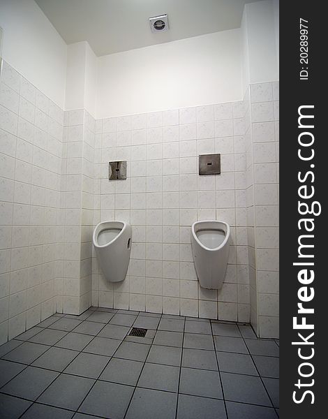 Interior of white toilet for man