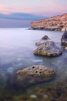 Sea And Rock At The Sunset. Stock Photo Sea And Rock At The Sunset. Stock Photo