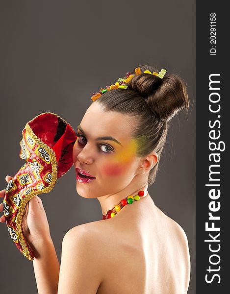 Close-up portrait of beautiful brunette with glamor make-up and color candy style