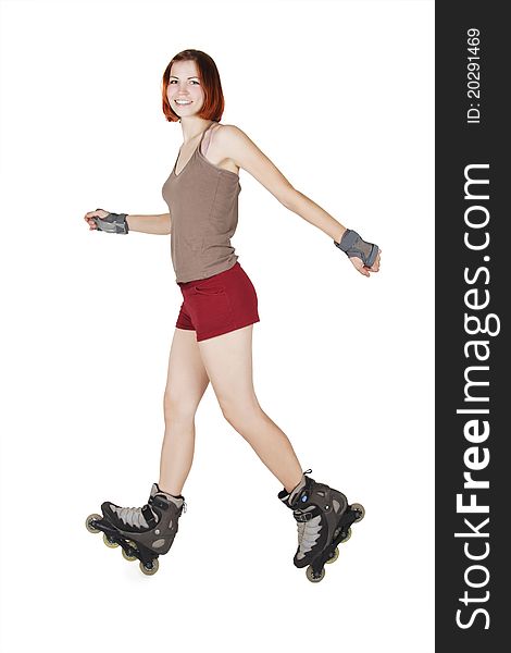 Young beauty girl on rollerblades making trick isolated