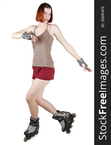 Young beauty girl on rollerblades isolated