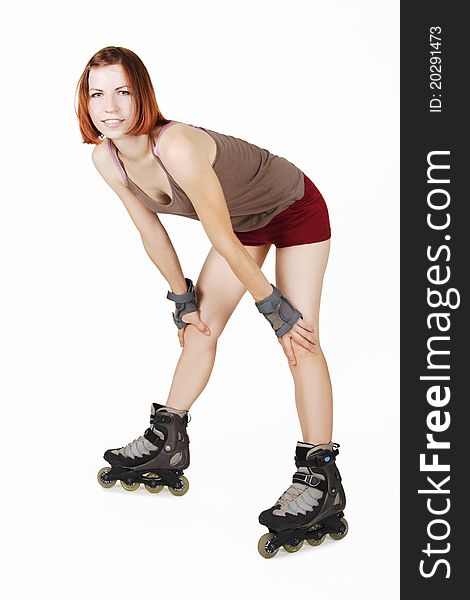 Young beauty girl on rollerblades isolated