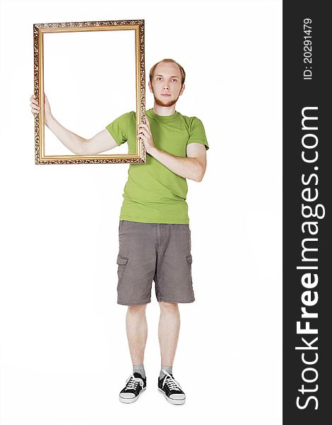 Man in green shirt holding decorative picture frame, isolated. Man in green shirt holding decorative picture frame, isolated