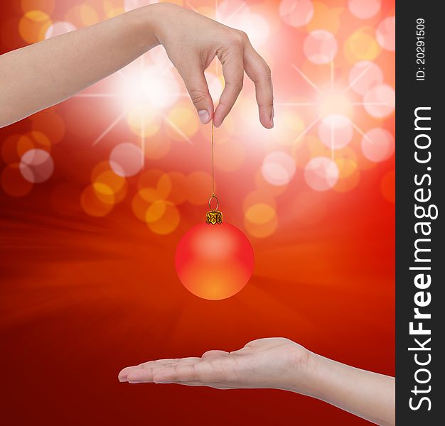 Human Hand Holding Transparent Christmas Ball.