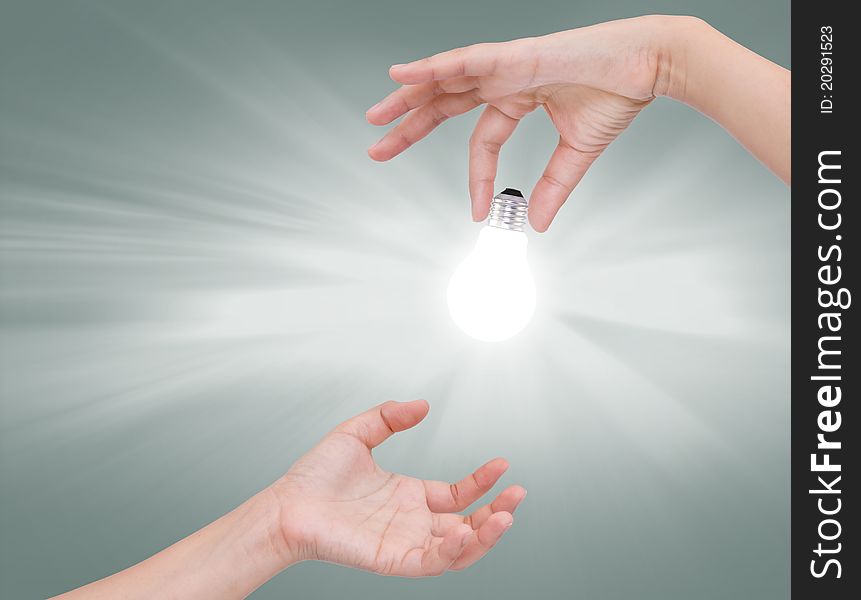 Women hand with Light bulb