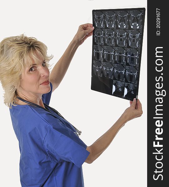 Mature woman medical specialist inspecting radiology result. Mature woman medical specialist inspecting radiology result