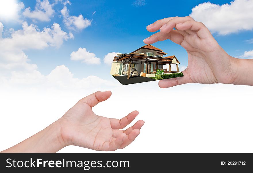 The house in human hand over blue sky. The house in human hand over blue sky.