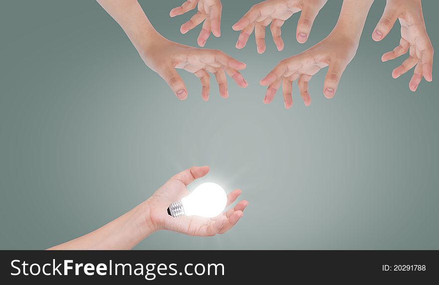 Light bulb on hand.