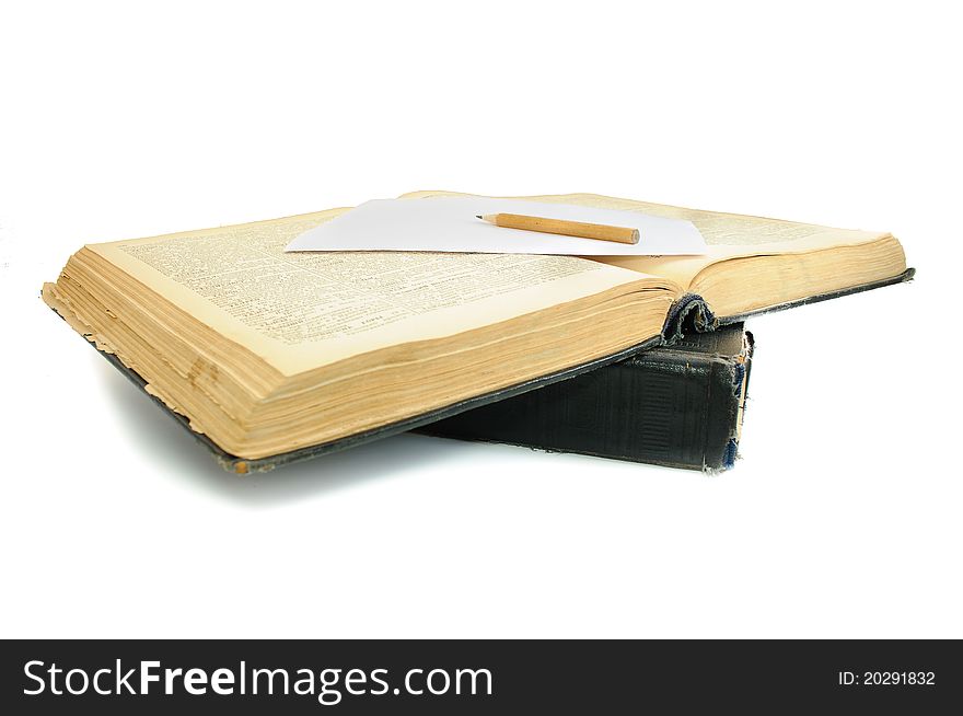 The oldest book and pencil. Isolated on white background