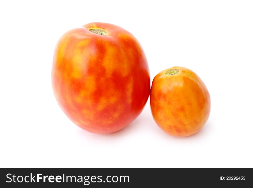 Fresh tomatoes on a white background close-up isolated