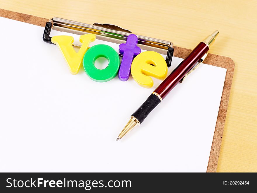Vote Letters On Clipboard With Pen. Vote Letters On Clipboard With Pen