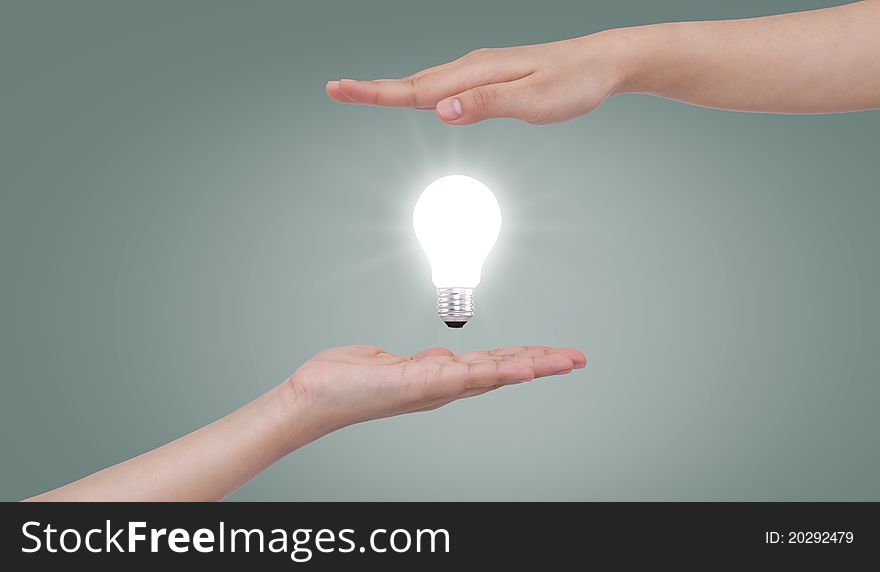 Light bulb in hand.